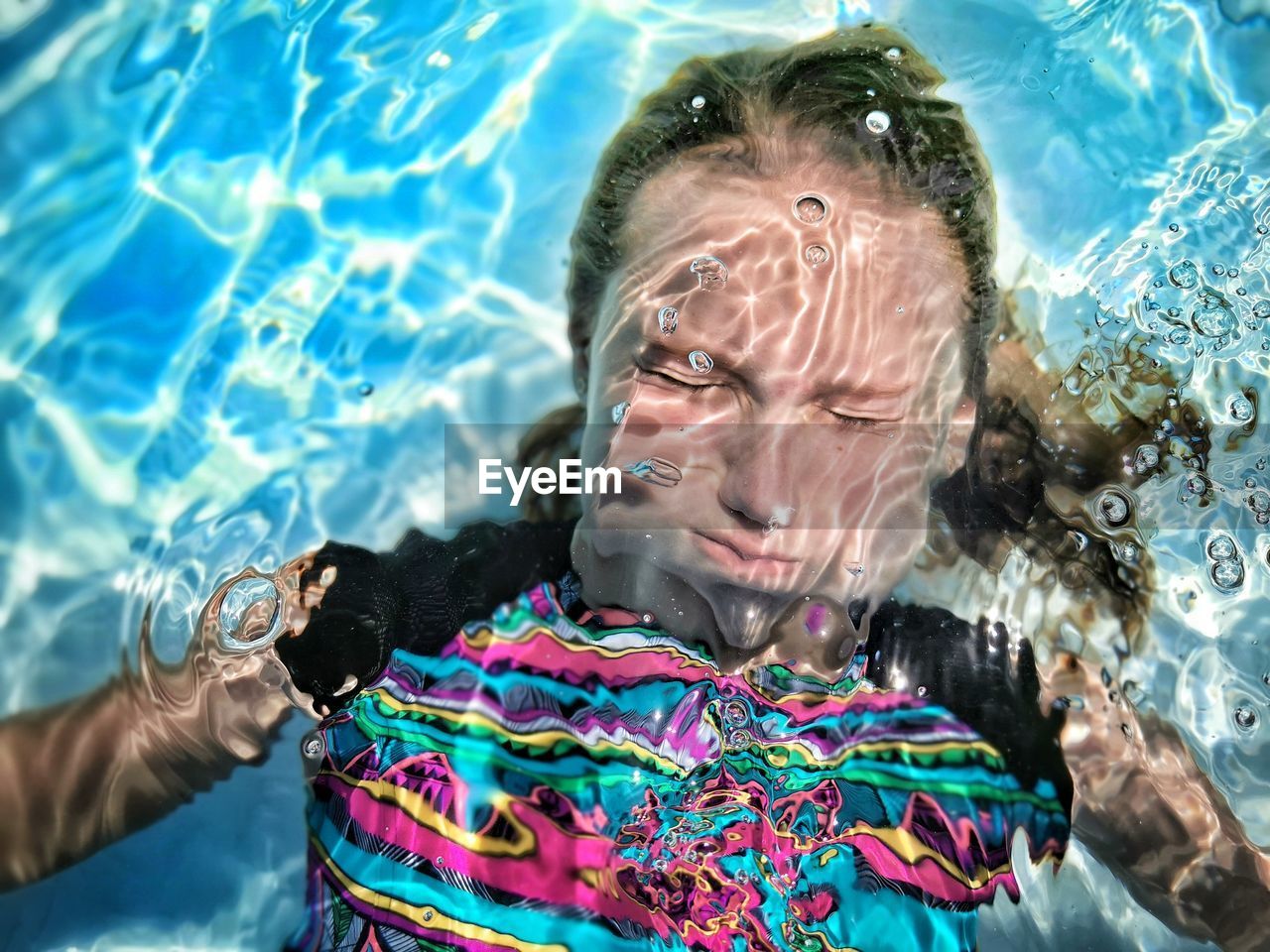 Portrait of woman swimming in sea