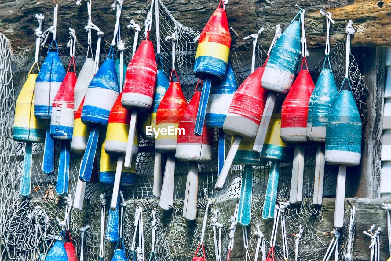Colorful buoys handing on railing