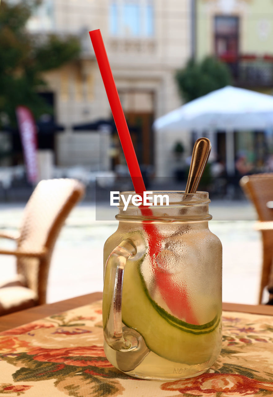 Close-up of cocktail in glass jar on table at restaurant