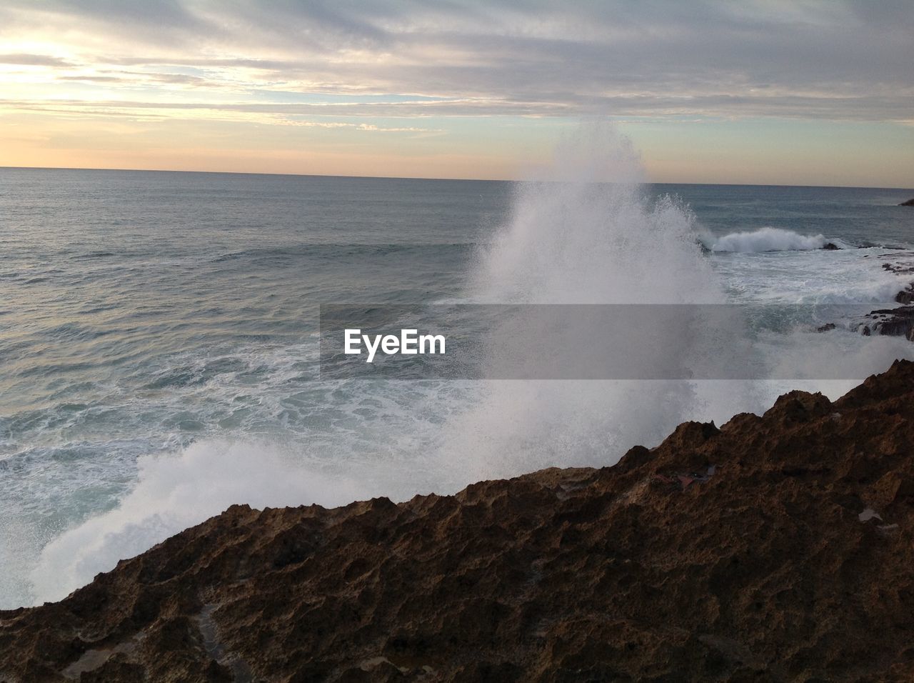 WAVES BREAKING AGAINST SEA