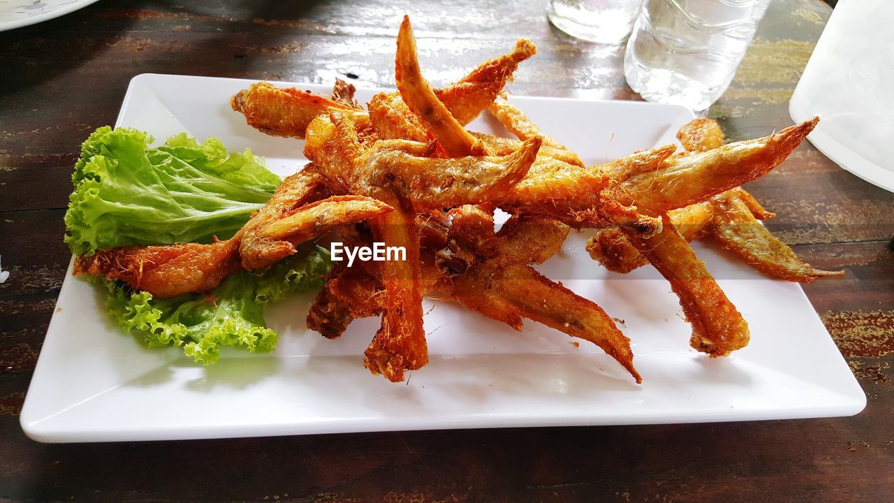 High angle view of fried chicken served in plate on table