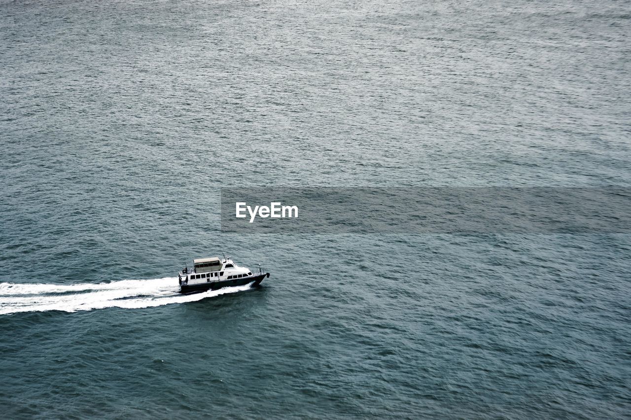 High angle view of ship sailing on sea