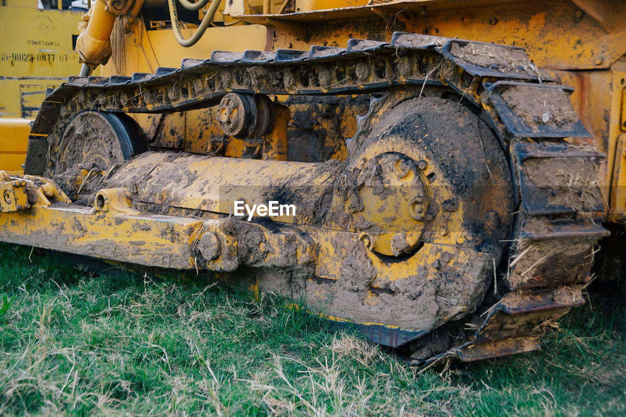 Close-up of earth mover on field