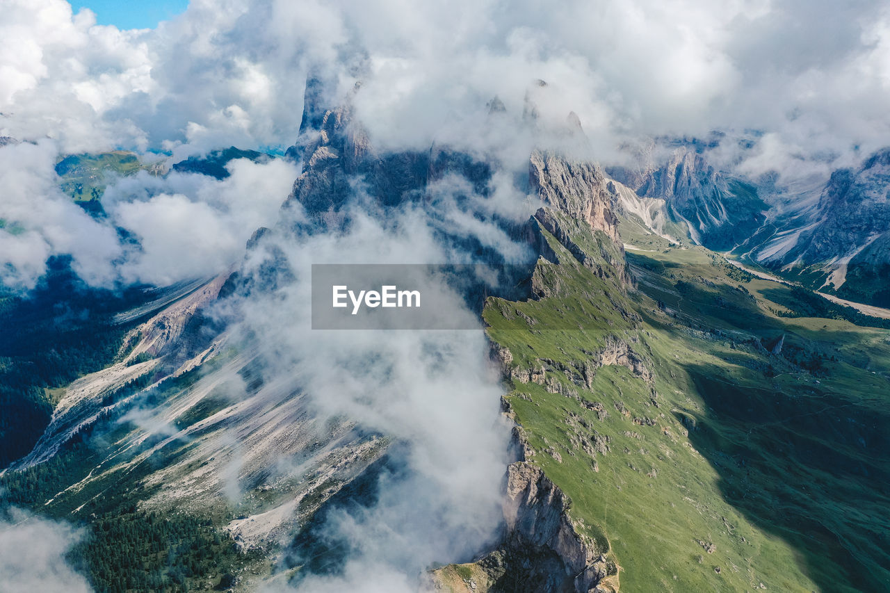 Aerial view of mountain range against sky