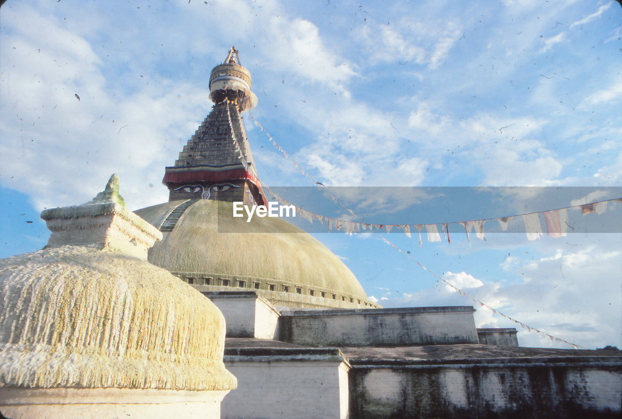 architecture, built structure, religion, place of worship, landmark, travel destinations, belief, temple - building, building exterior, sky, travel, history, spirituality, the past, cloud, temple, building, nature, dome, tower, ancient, tourism, no people, pagoda, city, outdoors, tradition, gold, environment, landscape