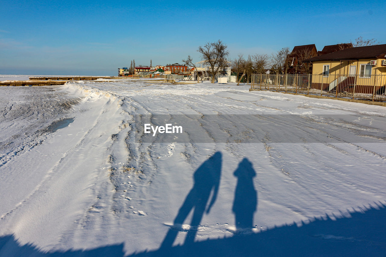 PEOPLE ON SNOW COVERED LAND