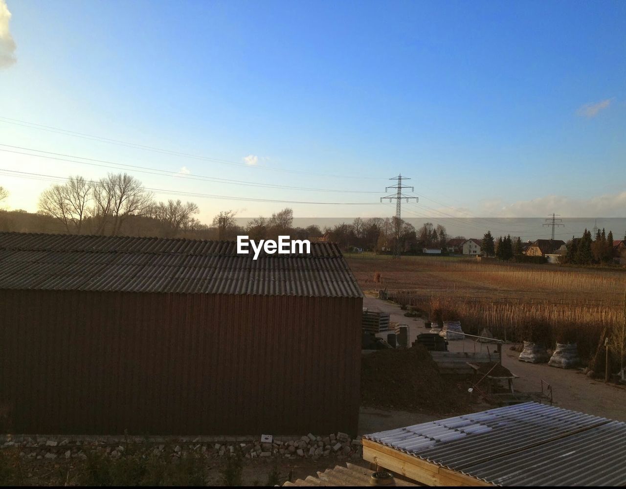 VIEW OF LANDSCAPE AGAINST BLUE SKY