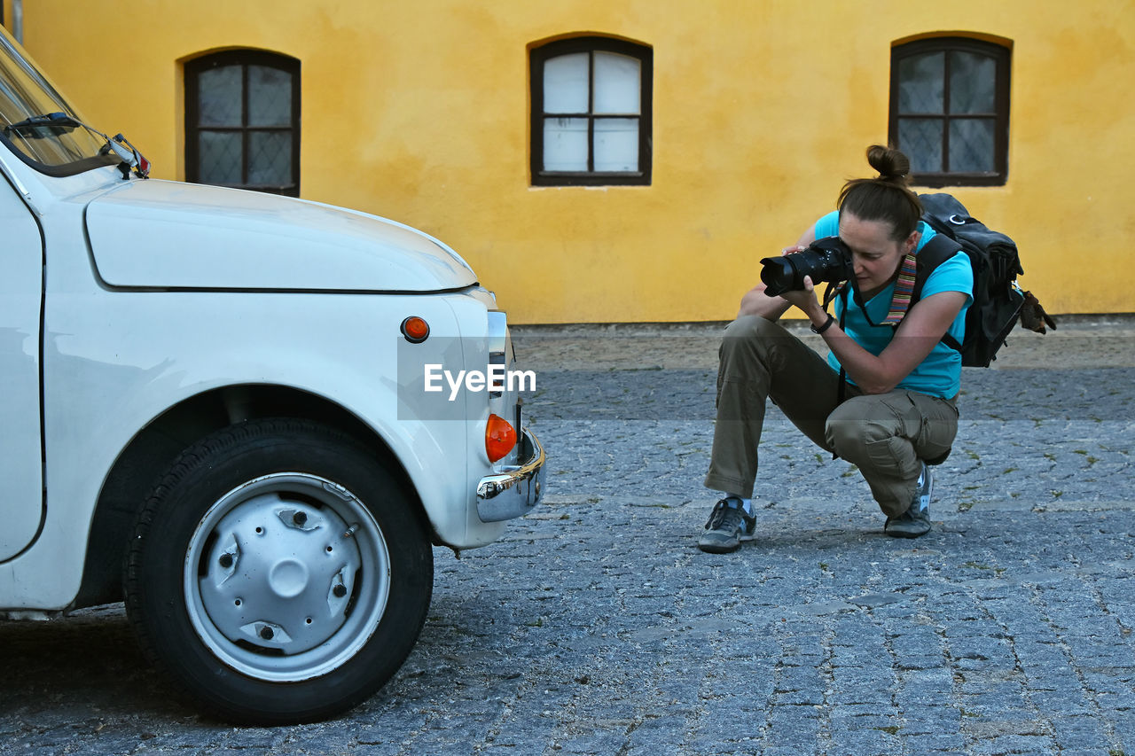 SIDE VIEW OF A MAN AND WOMAN ON STREET