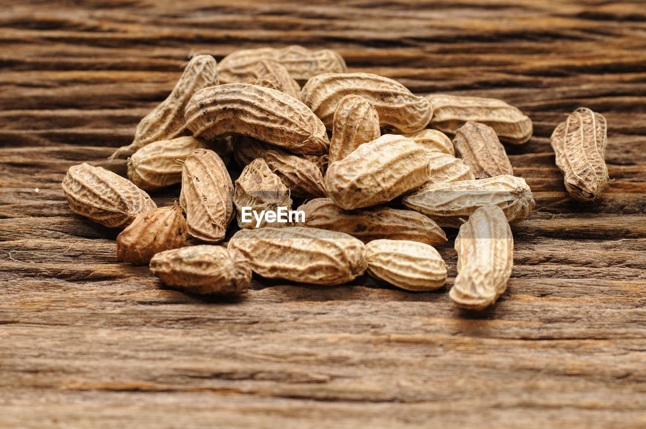 CLOSE-UP OF BREAD ON TABLE AGAINST GRAY BACKGROUND