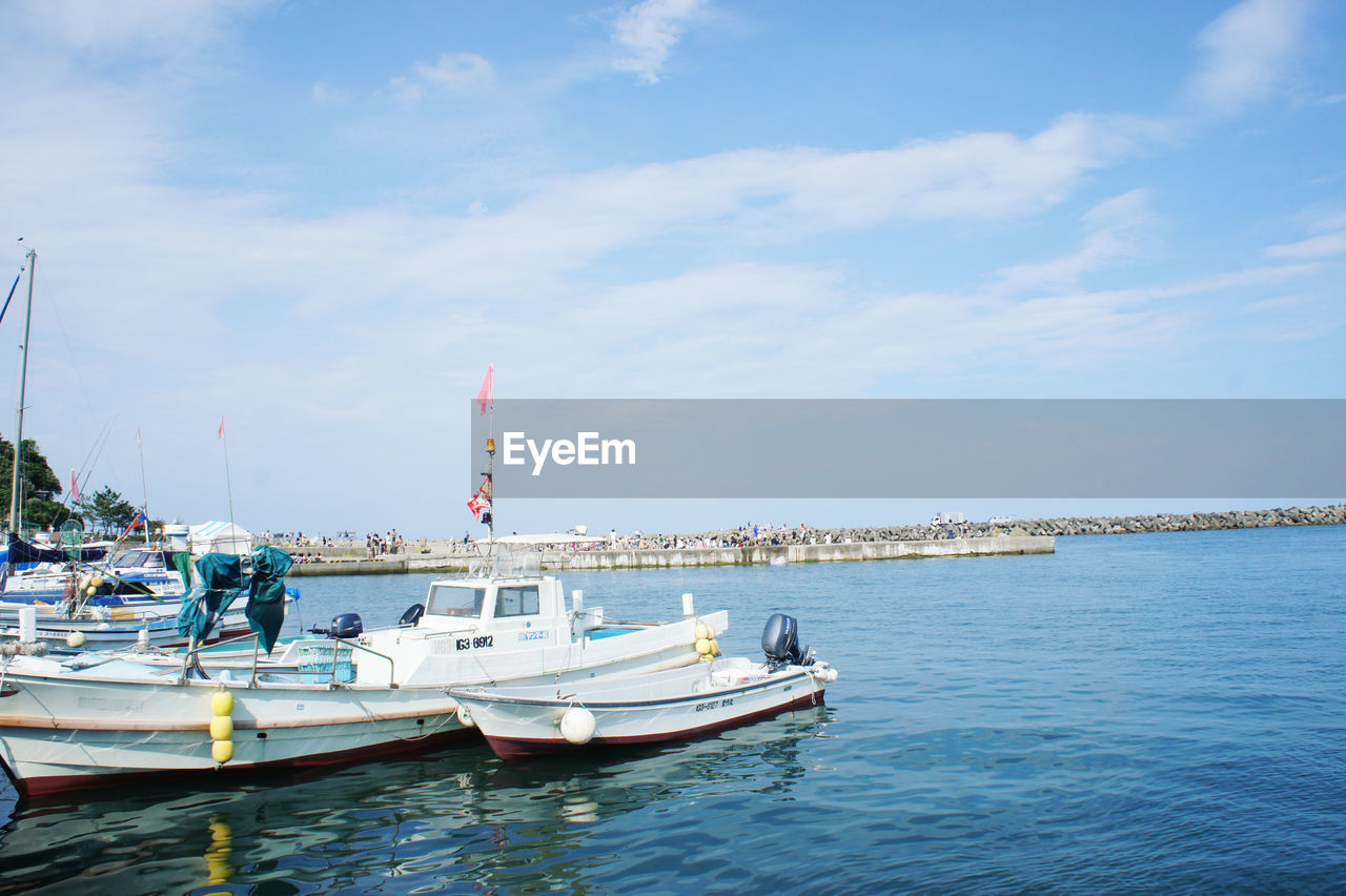 BOATS MOORED IN SEA