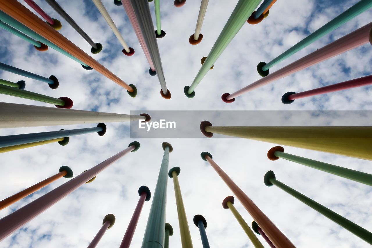 Low angle view of decorations hanging on metal