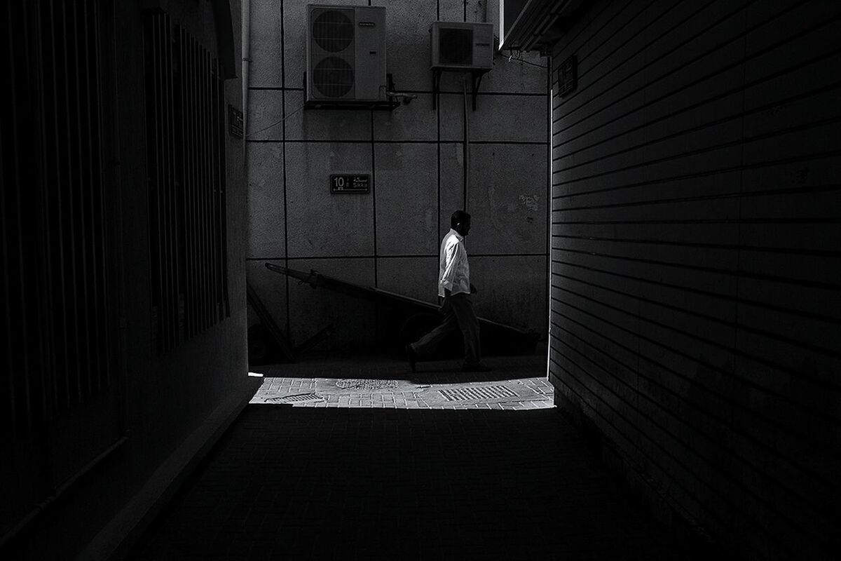 WOMAN STANDING ON RAILING