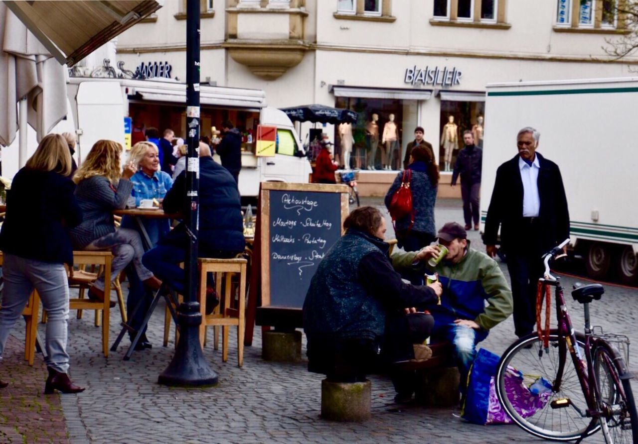 MEN IN TOWN SQUARE