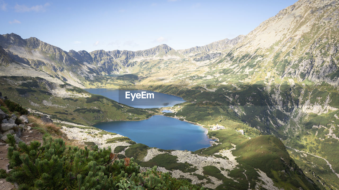 Beautiful alpine valley with mountain peaks, lakes, and some vegetation. poland, europe