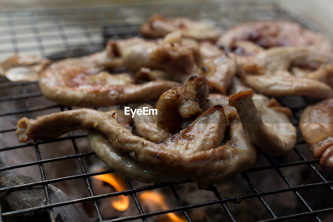 CLOSE-UP OF CHICKEN ON BARBECUE