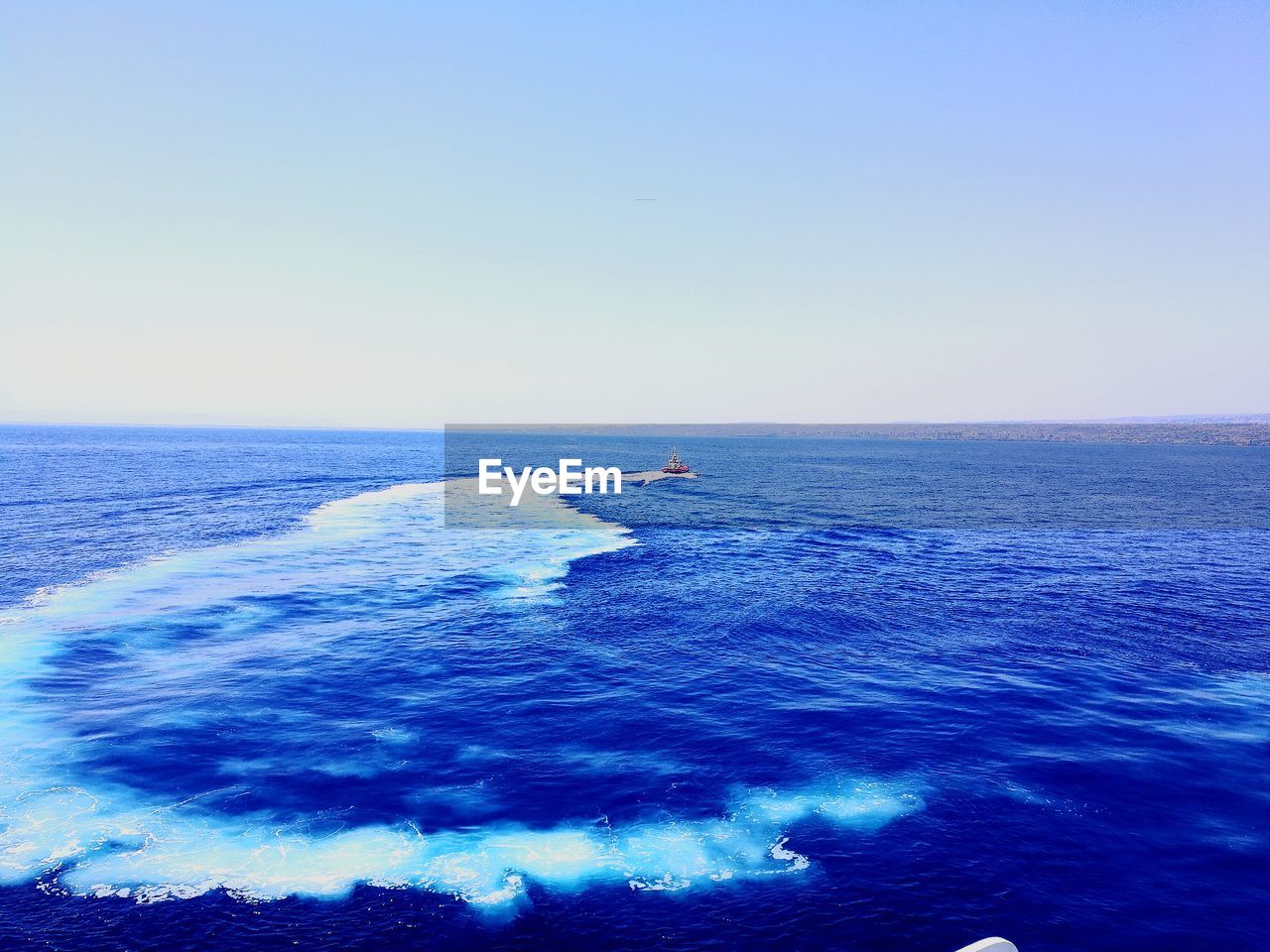 VIEW OF SEA AGAINST CLEAR BLUE SKY