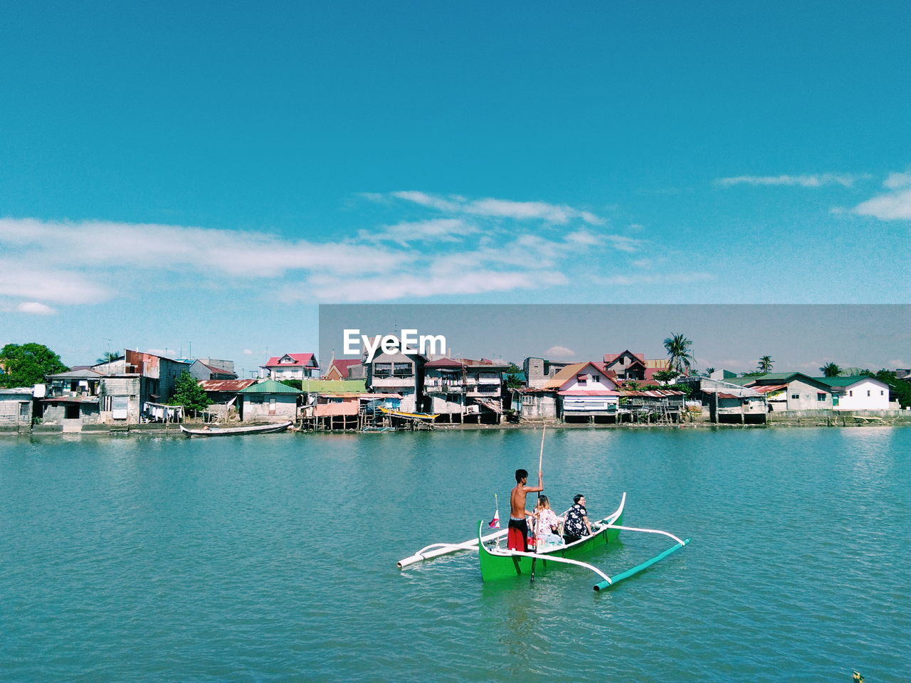 PEOPLE ON BOAT IN WATER