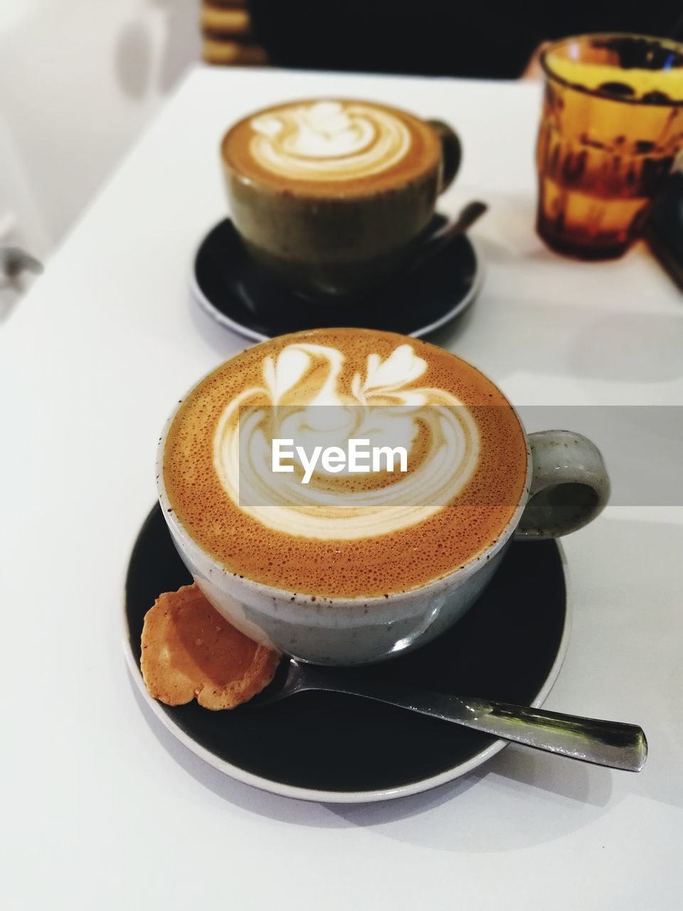 CLOSE-UP OF COFFEE SERVED ON TABLE AT HOME