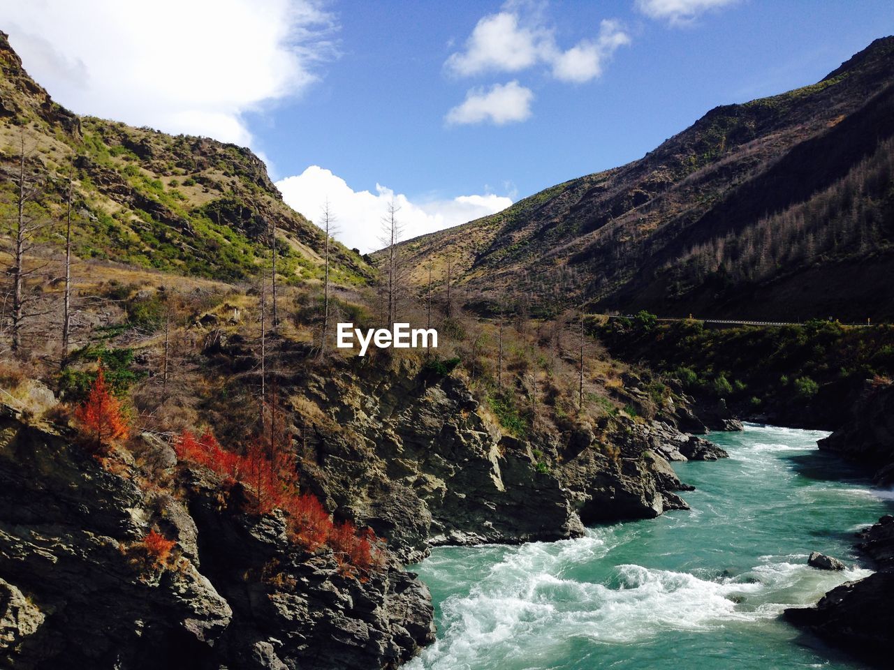 Scenic view of river flowing through mountain