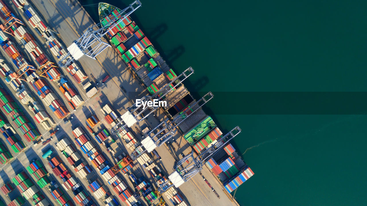 Aerial view container ship freight shipping at port, global business logistic import and export.