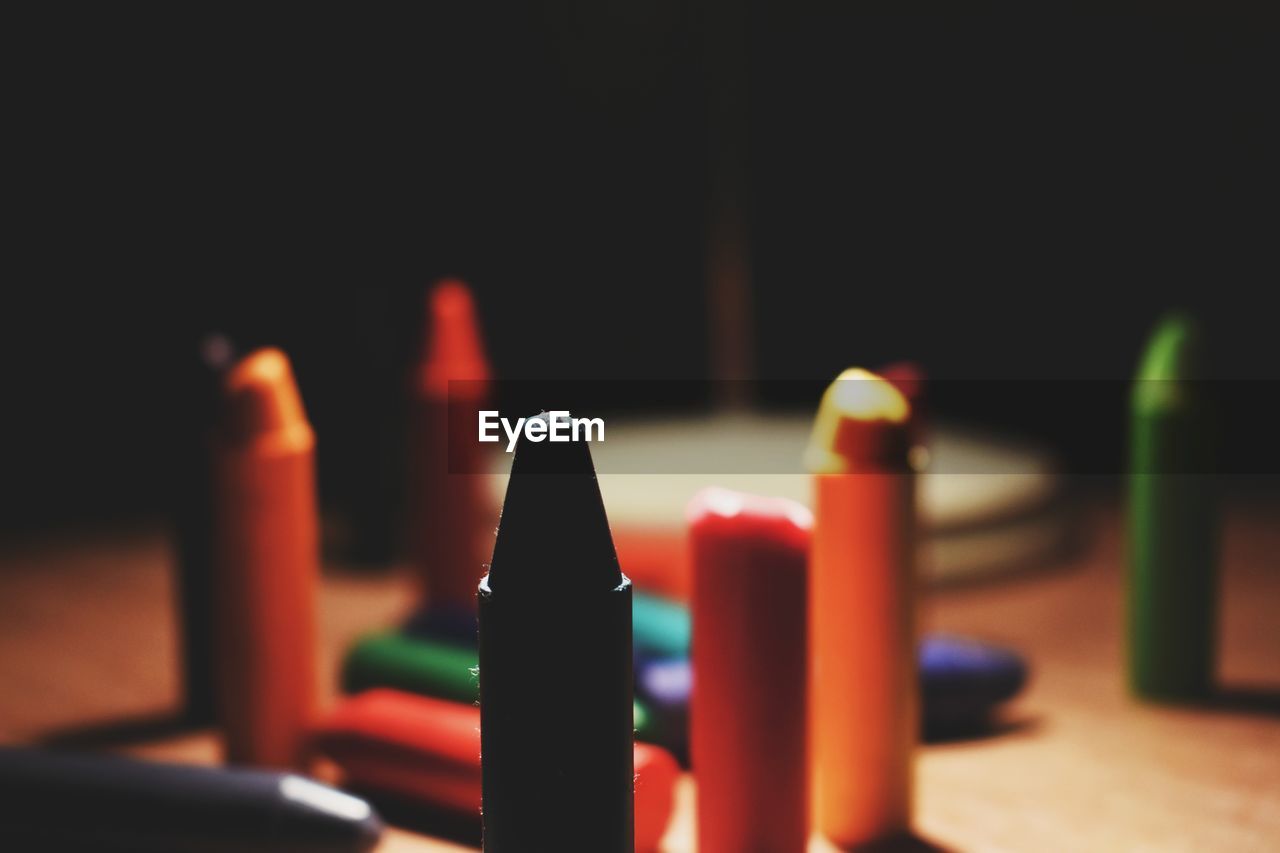 Close-up of crayons on table