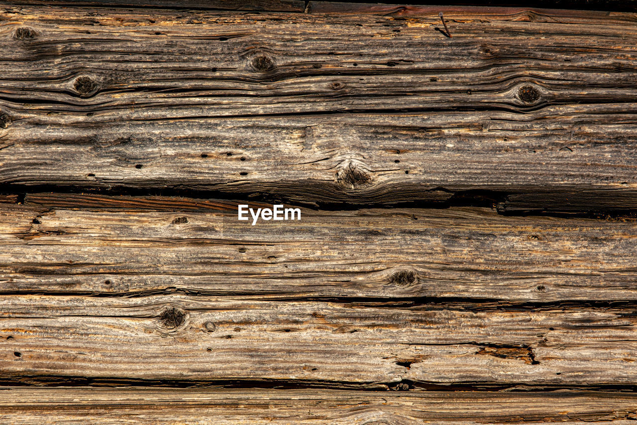 wood, backgrounds, textured, full frame, pattern, wood grain, plank, timber, no people, brown, rough, close-up, lumber, hardwood, floor, old, flooring, tree, abstract, weathered, wall, wood flooring, nature, striped, material, lumber industry, outdoors, textured effect, architecture, knotted wood, surface level, in a row, damaged, macro, copy space