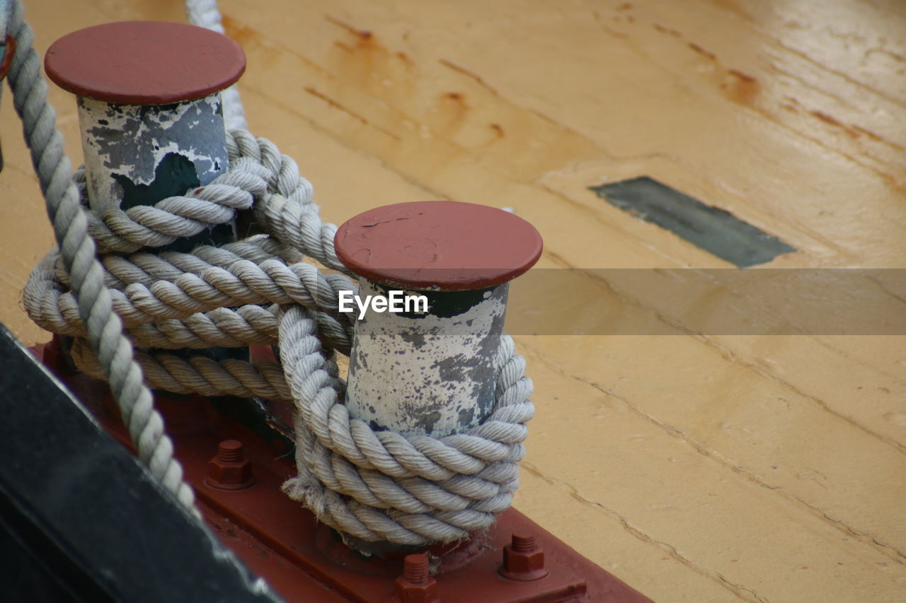 Close-up of rope tied to bollard