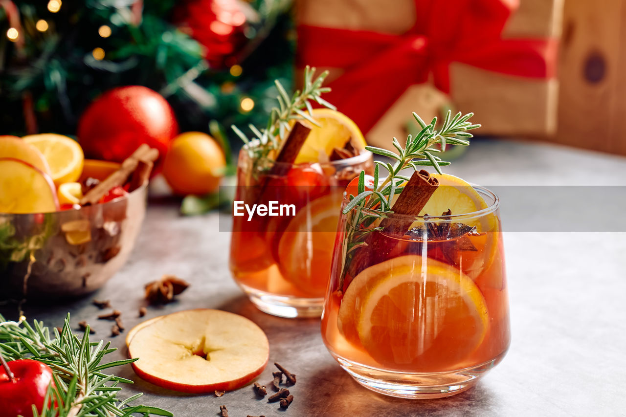 Mulled wine or christmas sangria with aromatic spices, apple, cherry and citrus fruits.