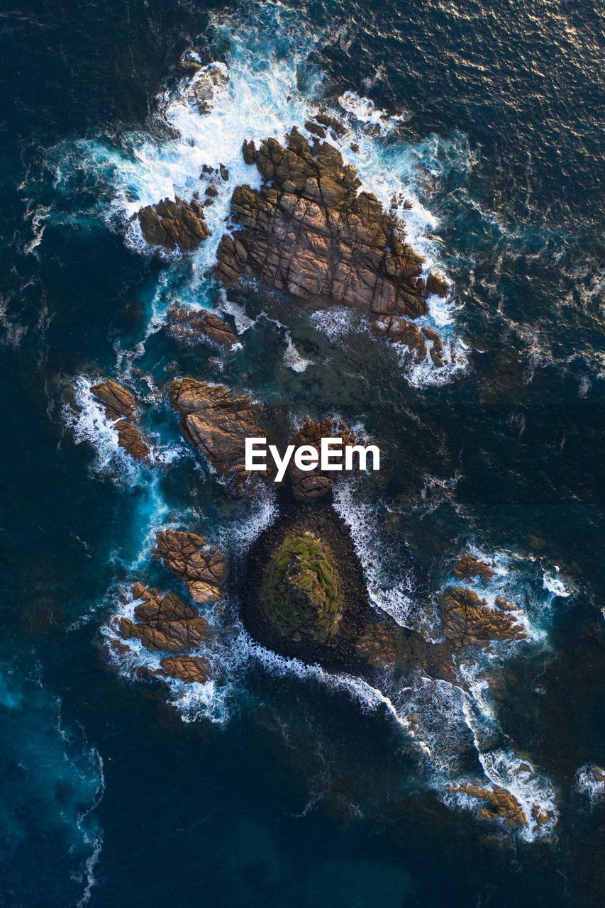 High angle view of rock formation in sea