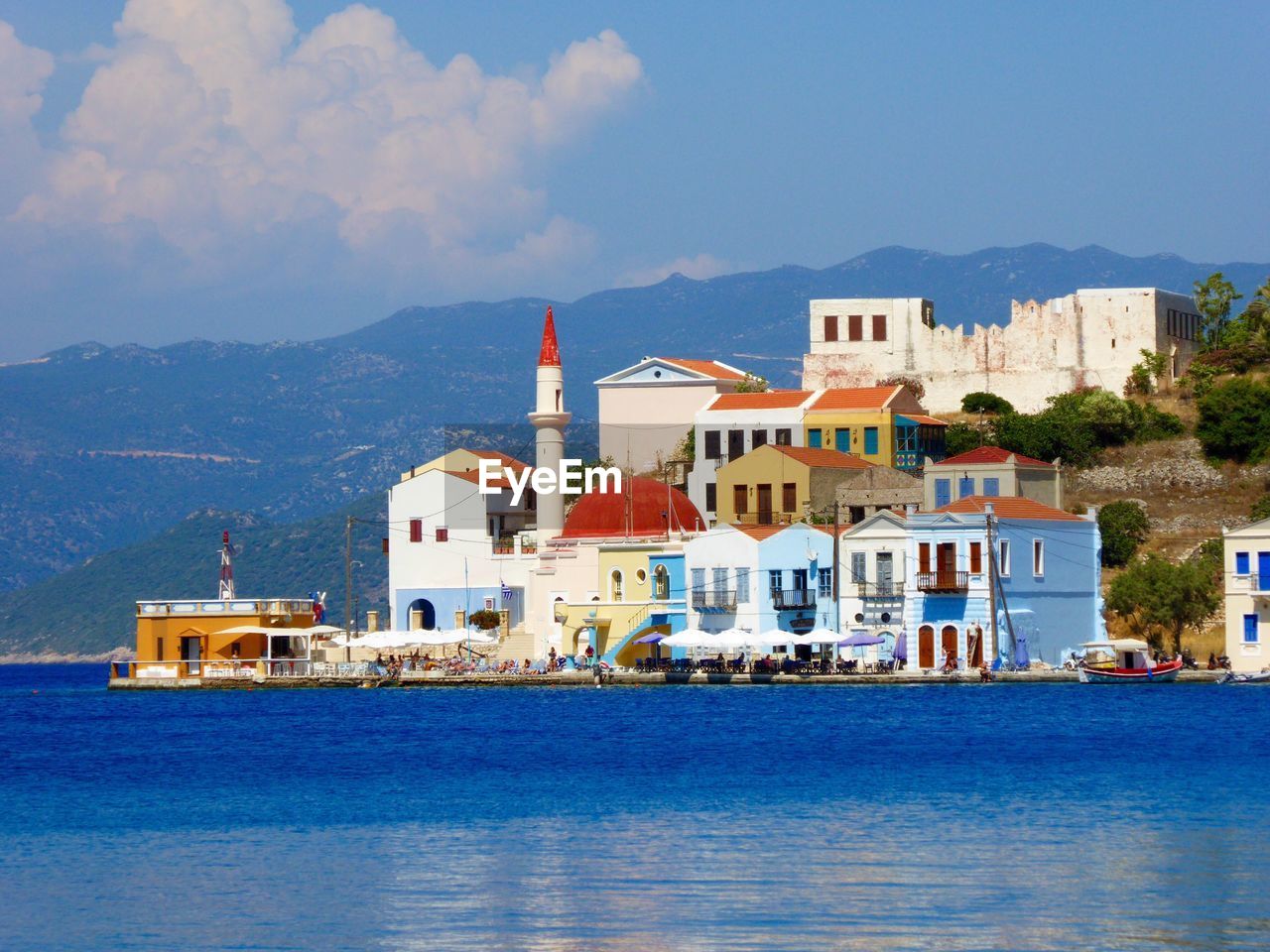 View of town against cloudy sky