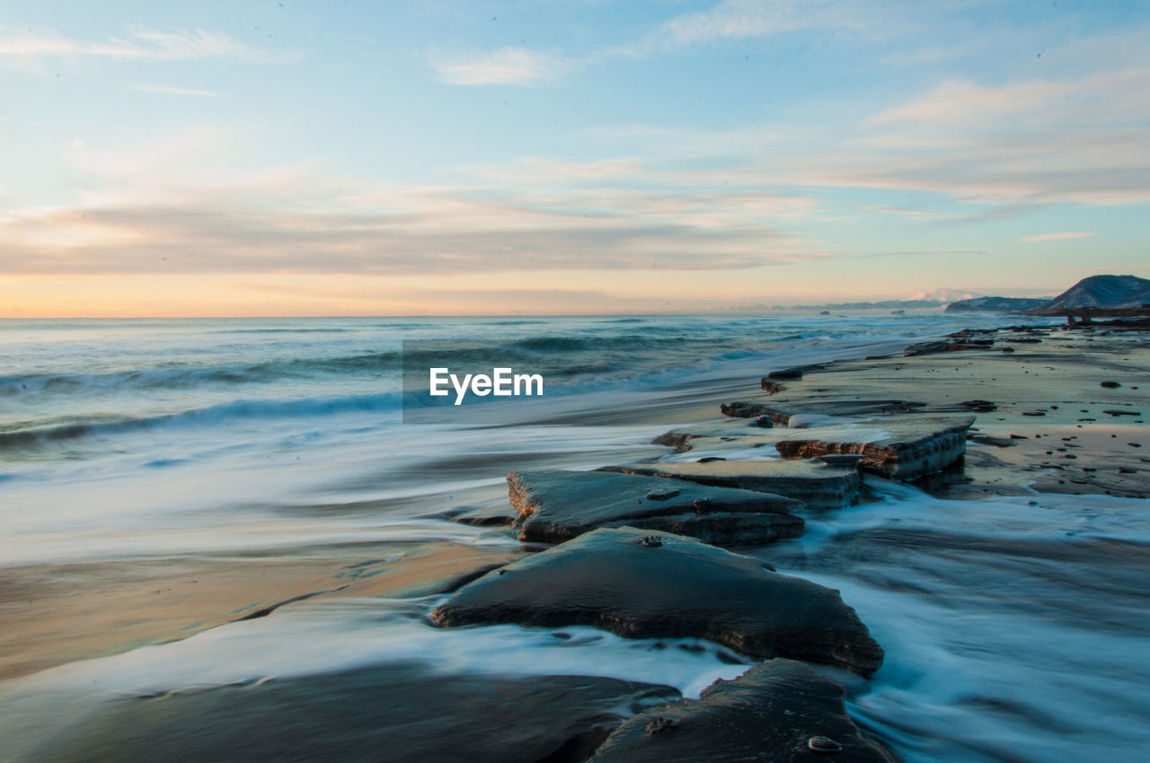 Scenic view of beach against sky