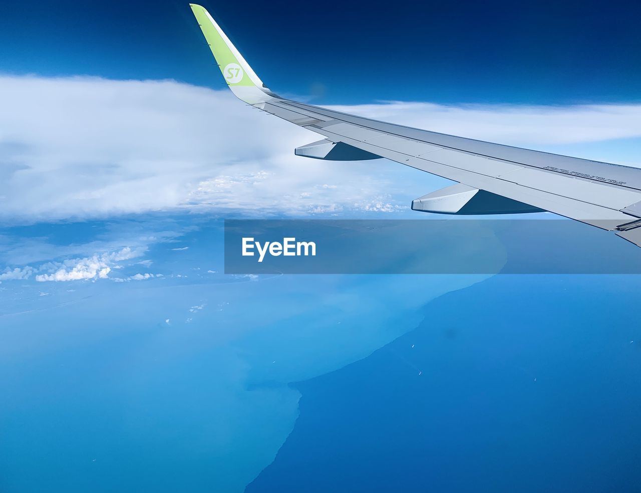 AERIAL VIEW OF CLOUDS OVER WATER