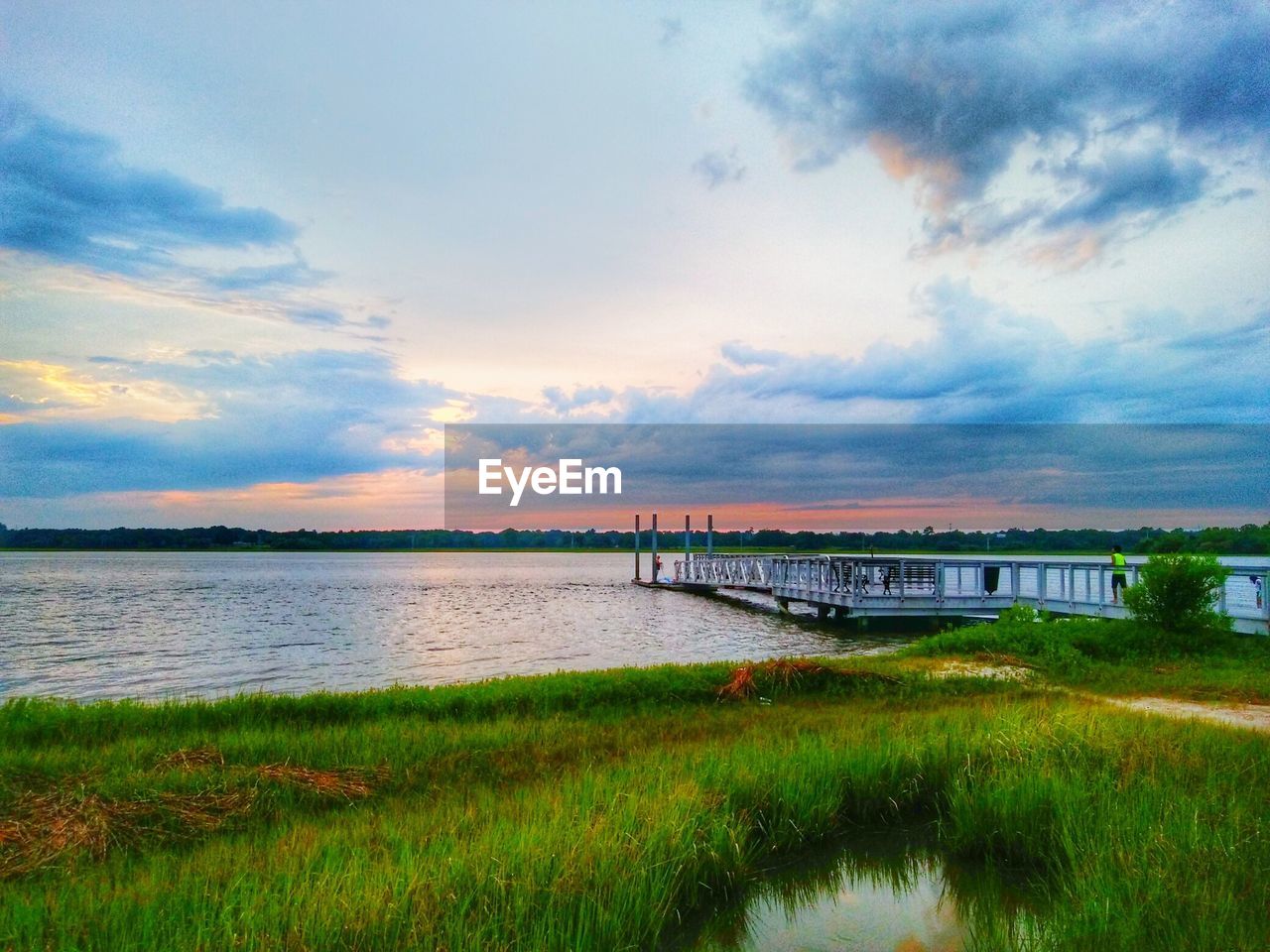 VIEW OF RIVER AGAINST CLOUDY SKY