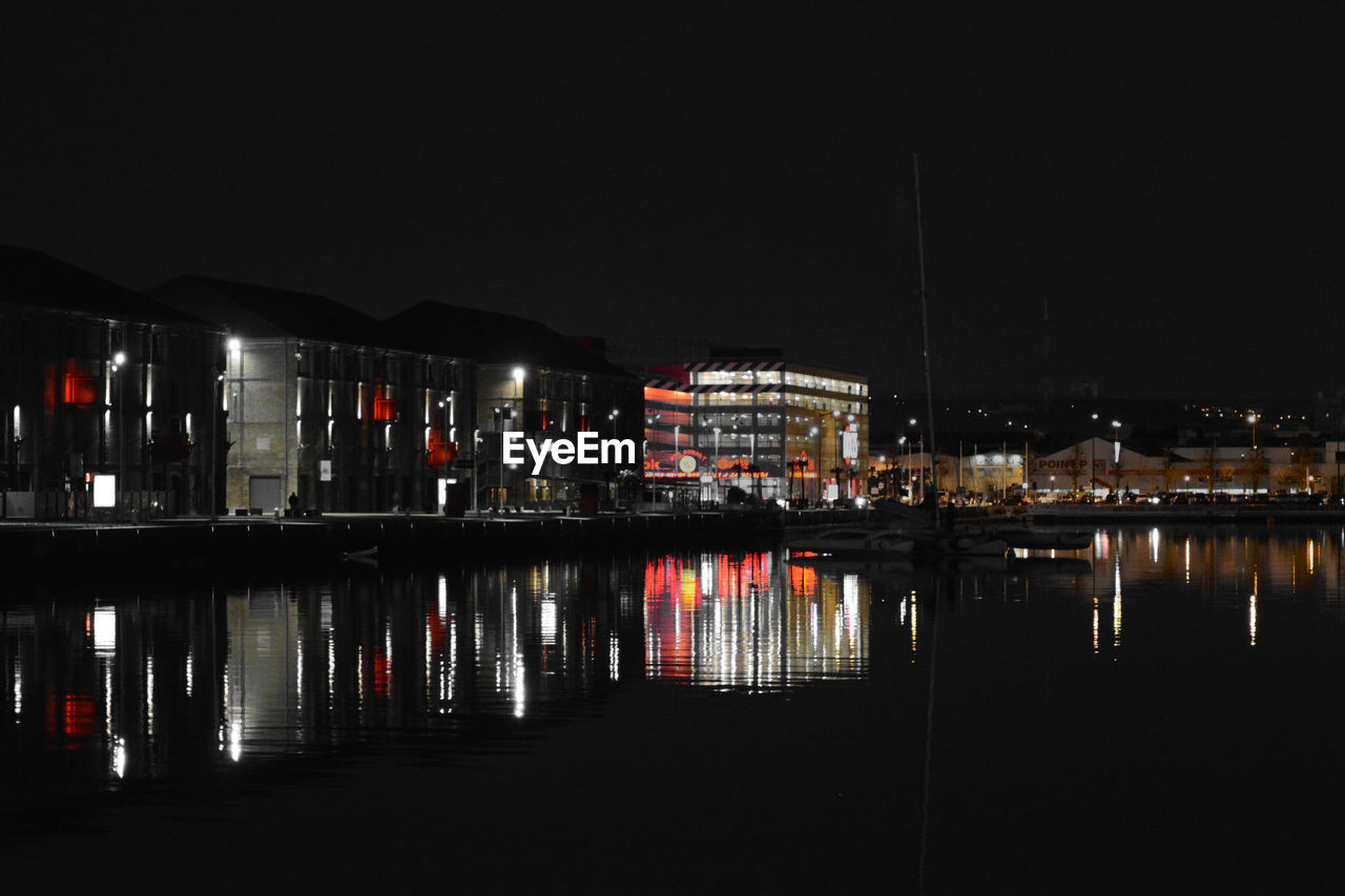 VIEW OF ILLUMINATED BUILDINGS AT NIGHT