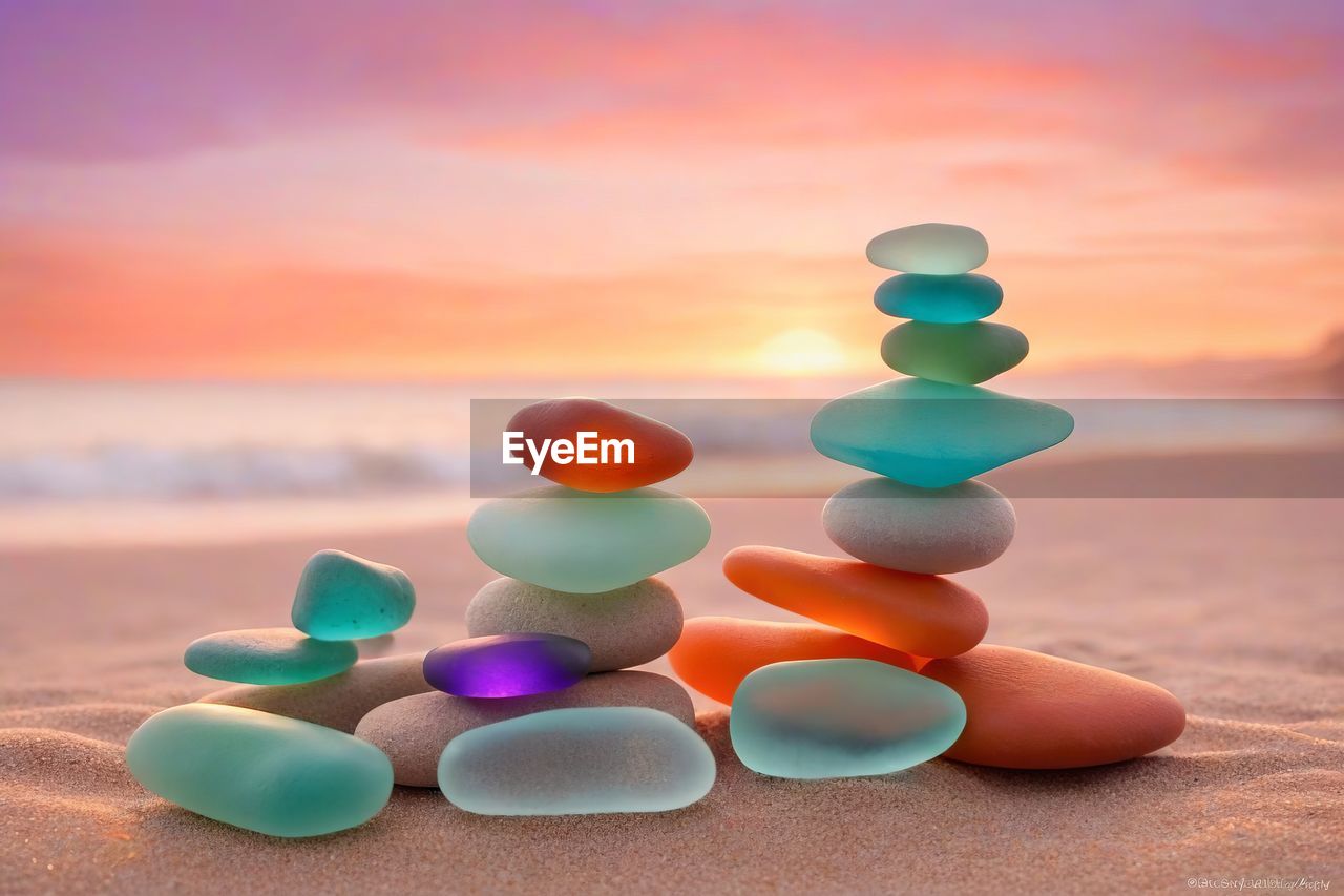 multi colored, blue, land, nature, large group of objects, no people, sky, beach, sand, sunset, healthcare and medicine, pill, orange color, medicine, group of objects, focus on foreground, environment, close-up, dose, still life, water