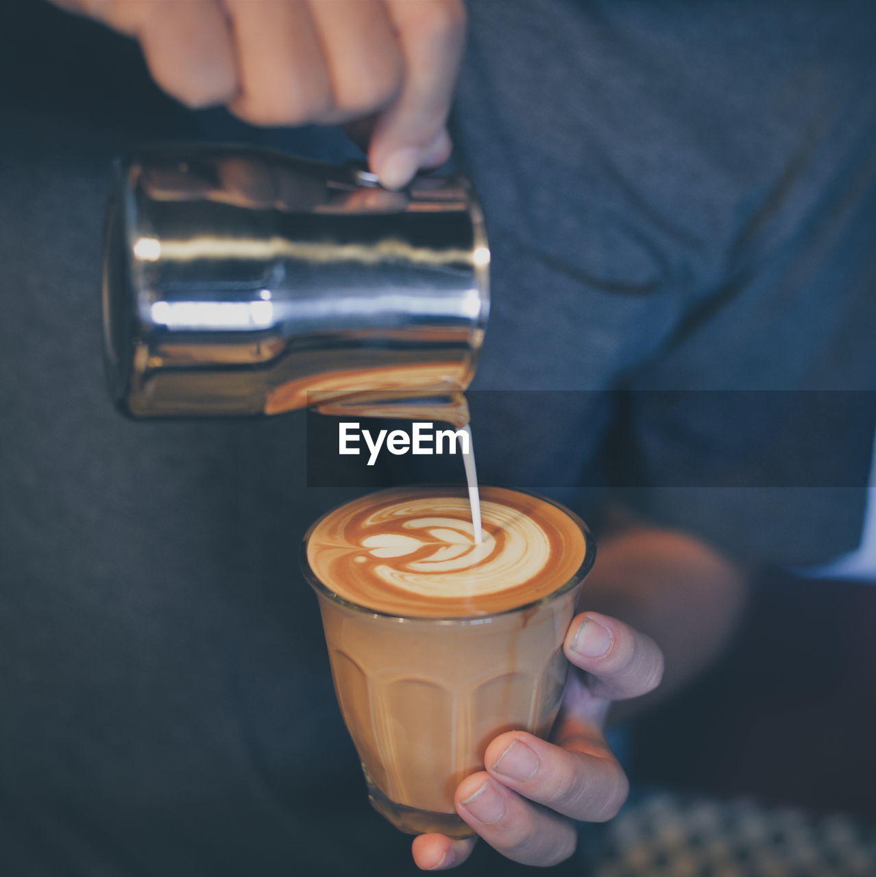 Midsection of man preparing coffee