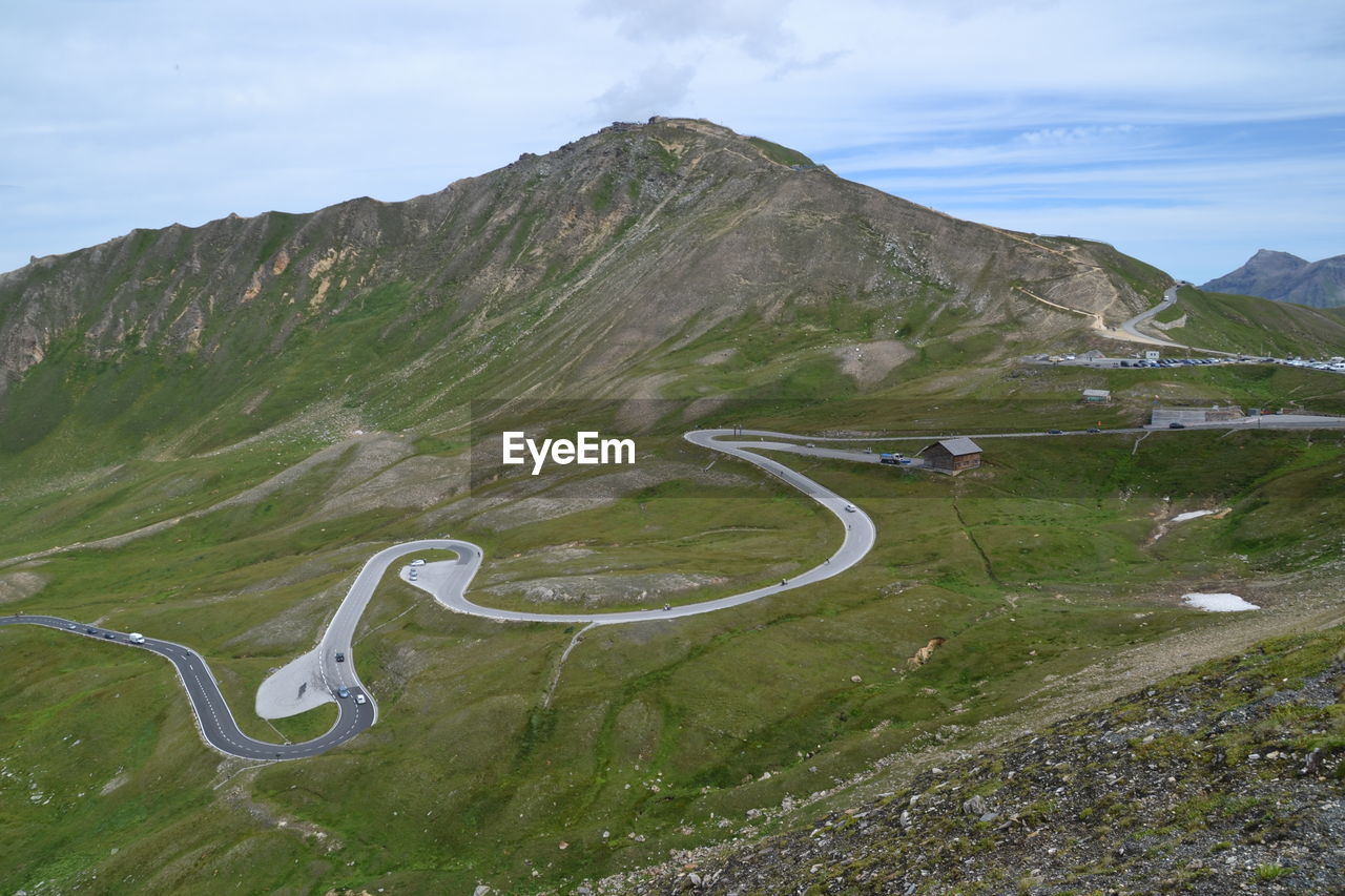 High angle view of winding road on mountain against sky