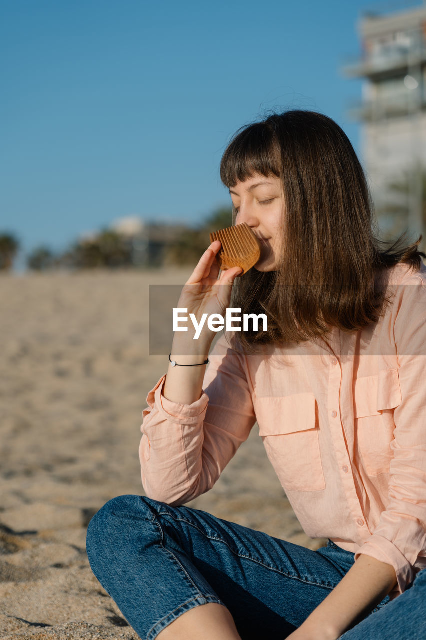 Young woman eating food