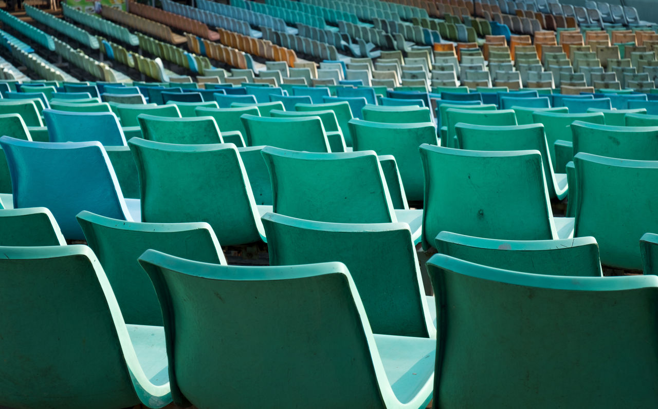 Full frame shot of empty chairs at stadium