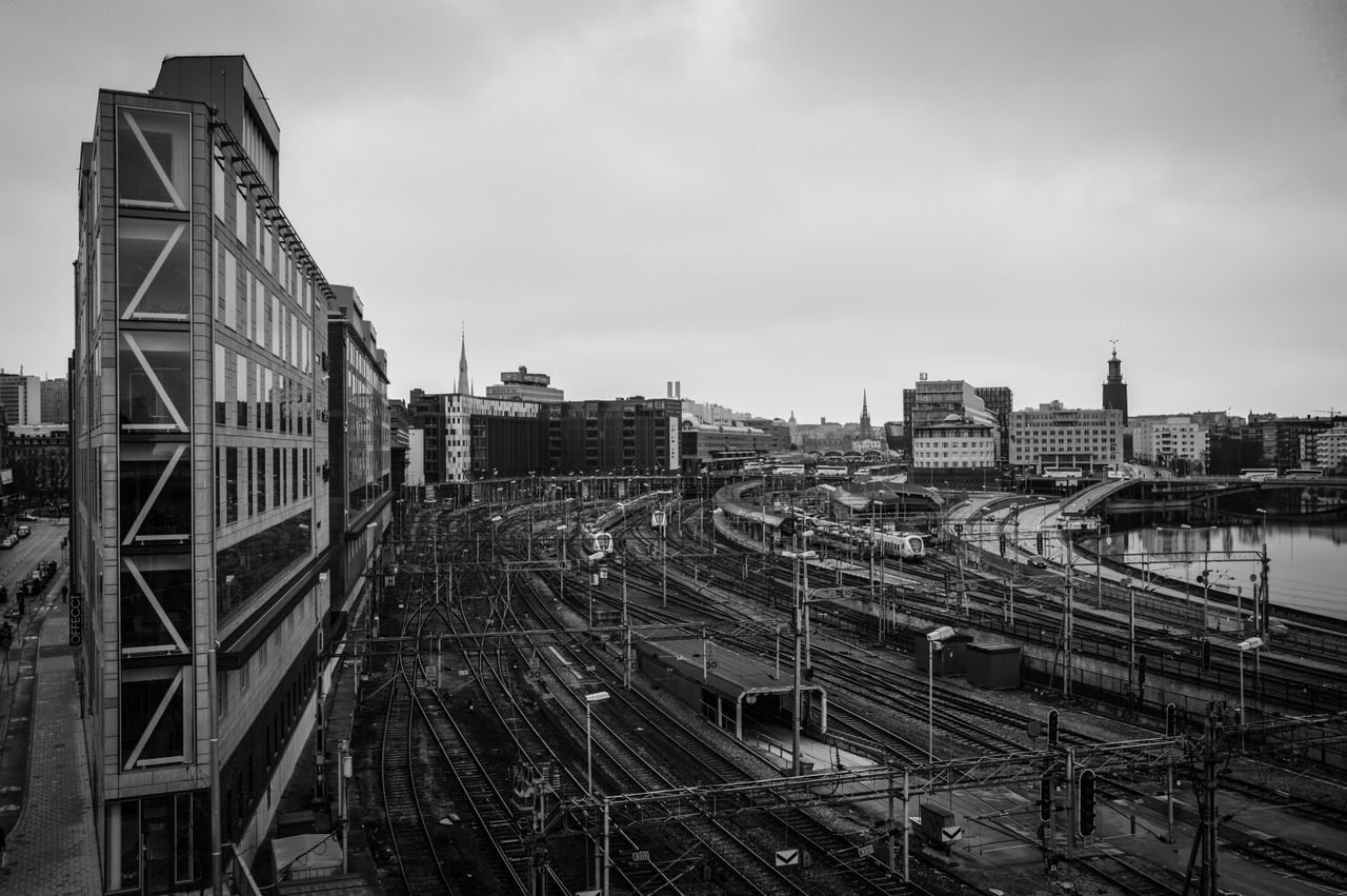 High angle view of railway tracks along buildings