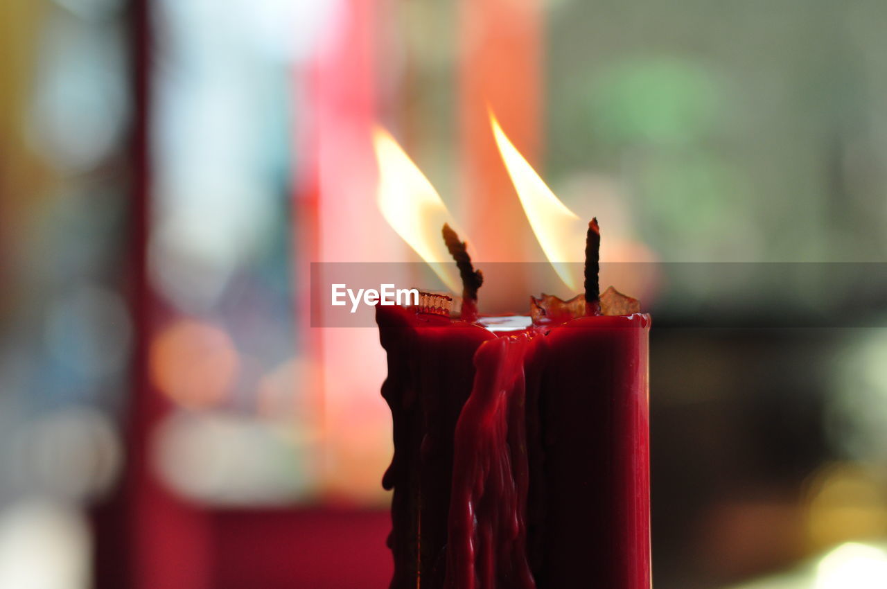 Close-up of burning candles