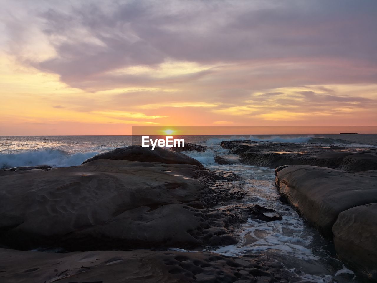 Scenic view of sea against sky during sunset