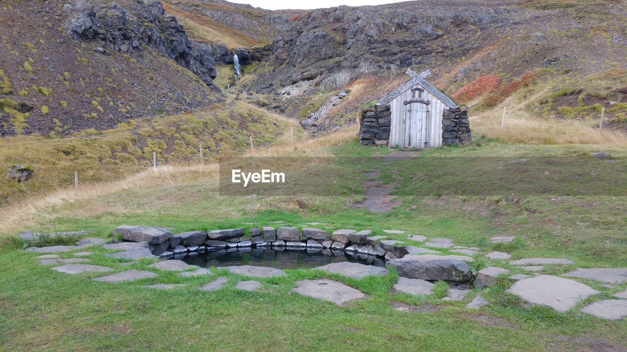 BUILT STRUCTURE IN GRASS