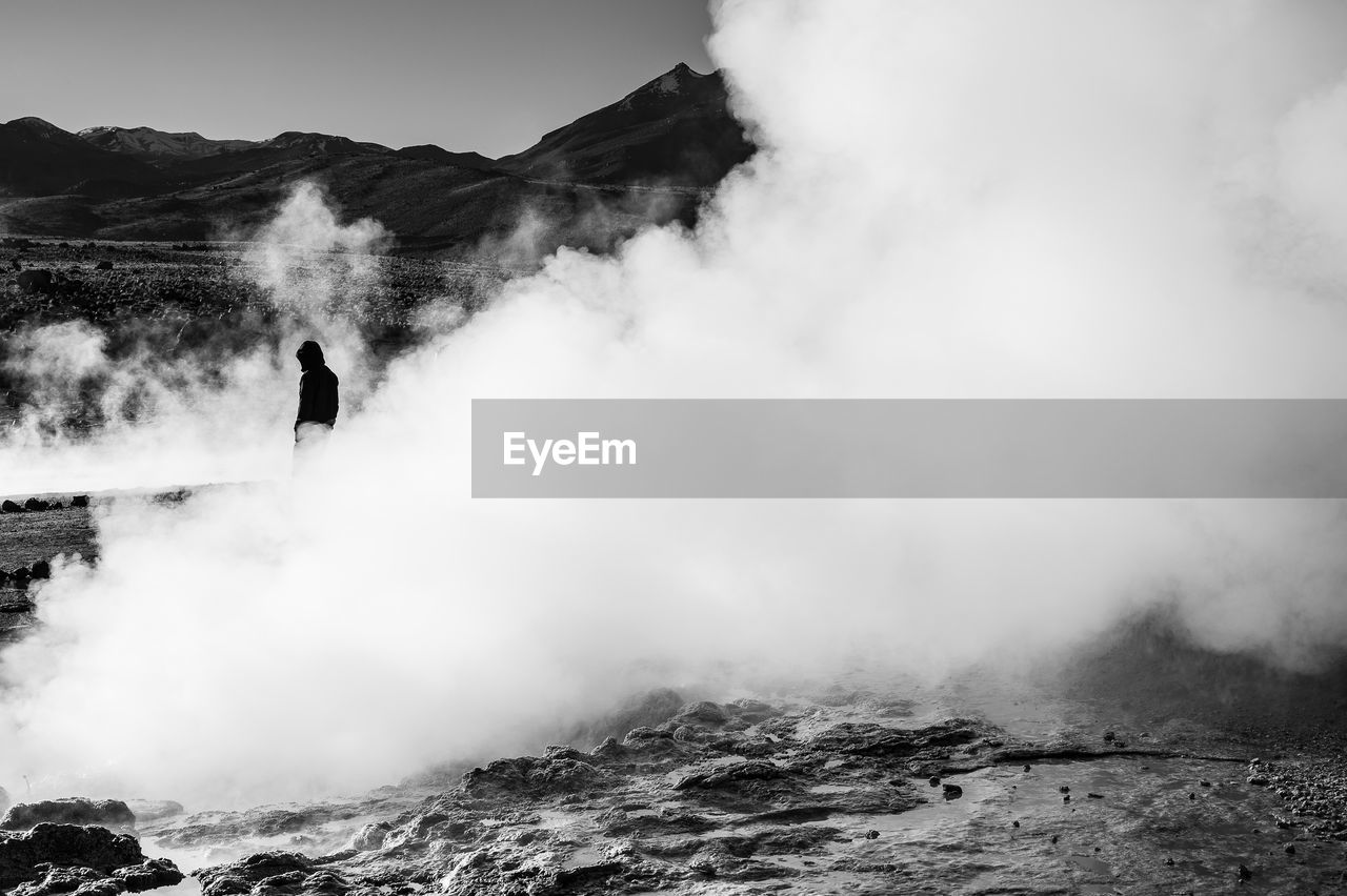 SCENIC VIEW OF MOUNTAIN AGAINST CLOUDY SKY