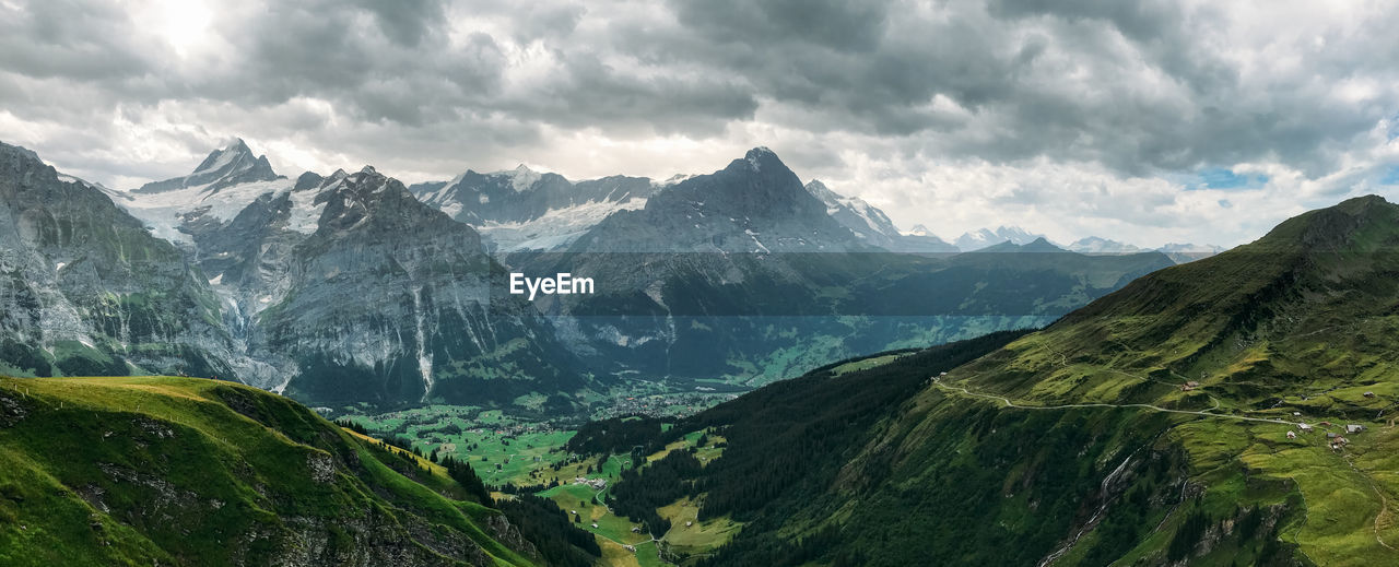 Panoramic view of swiss alps against cloudy sky