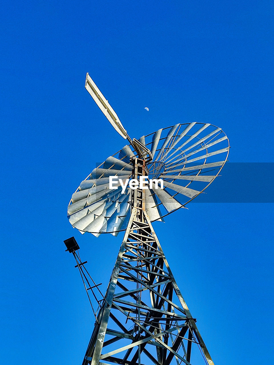 low angle view of windmill against clear blue sky