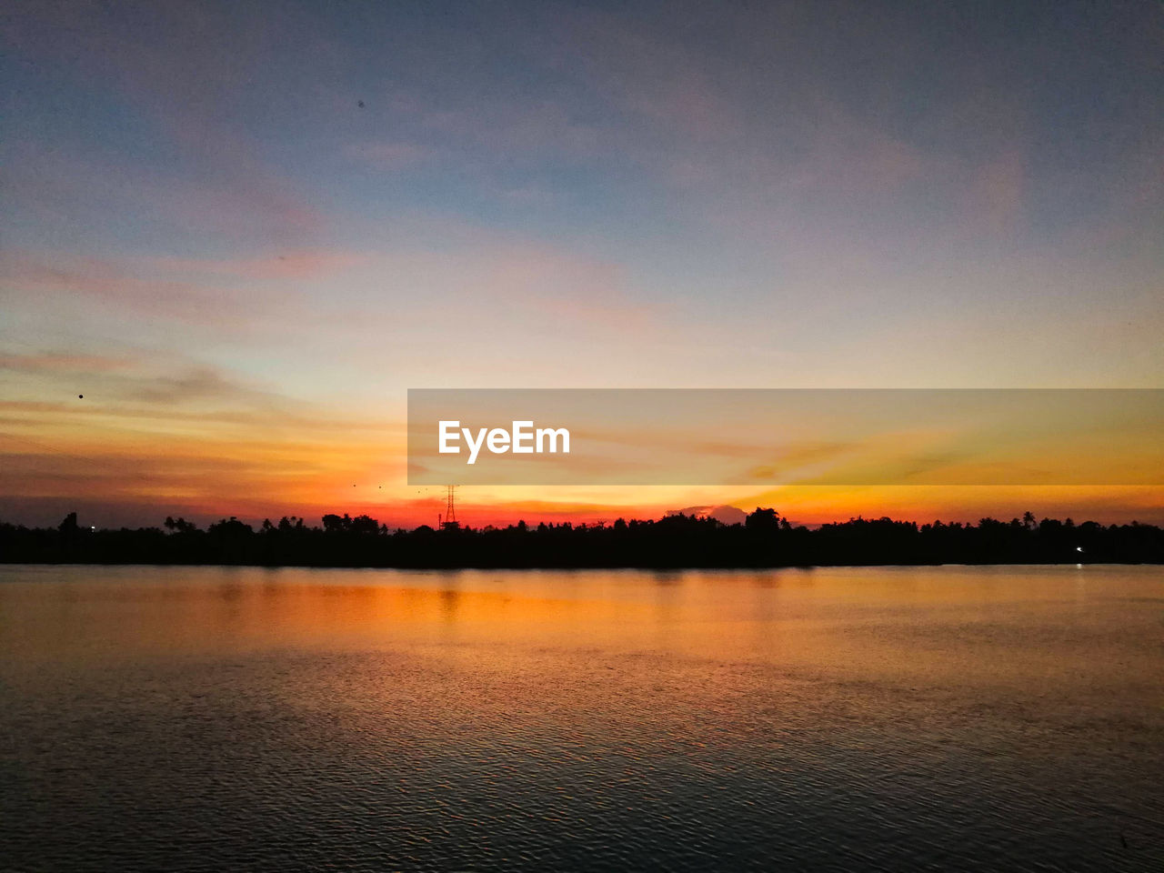 SCENIC VIEW OF LAKE AGAINST ROMANTIC SKY