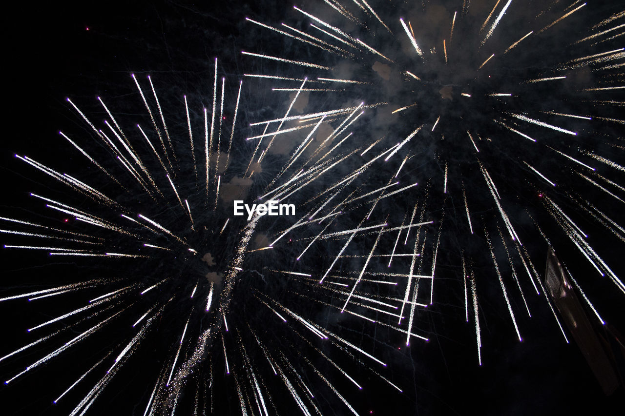 LOW ANGLE VIEW OF FIREWORK DISPLAY