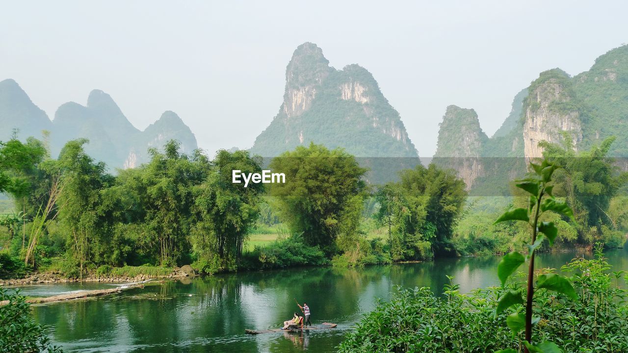 SCENIC VIEW OF LAKE AND MOUNTAINS