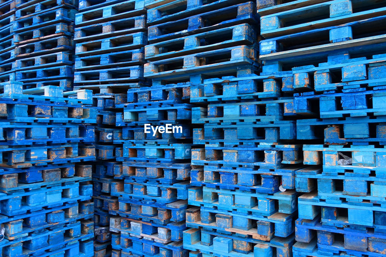Full frame shot of blue wooden crates at warehouse